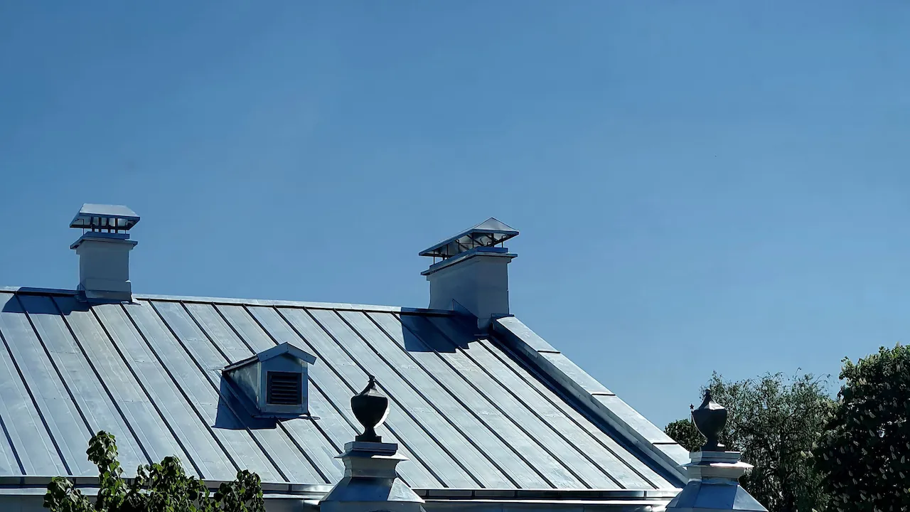 Finished standing seam roof, raking light across the seams